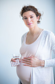 Woman taking medication during pregnancy