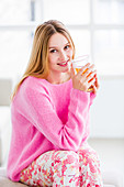 Woman drinking hot beverage