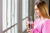 Woman drinking hot beverage