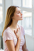 Woman doing breathing exercises
