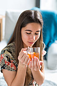 Woman drinking hot beverage