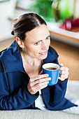 Woman drinking hot beverage