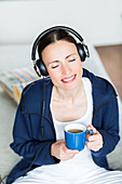 Woman drinking hot beverage