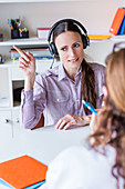 Woman undergoing pure-tone audiometry test