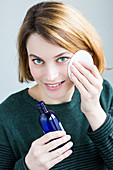 Woman using water lotion
