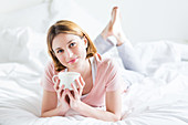 Woman drinking hot beverage