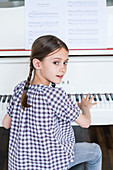 Girl studying piano
