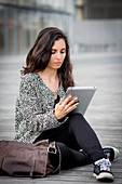 Woman using digital tablet