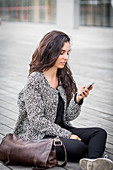 Woman using an Iphone