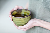 Woman drinking hot beverage