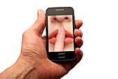 Smartphone with image of finger to lips
