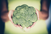 Woman holding broccoli