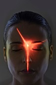 Woman with red light on face