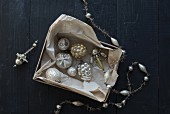 Old Christmas decorations and paper in old box