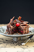 Chocolate tart with cherries and grated chocolate