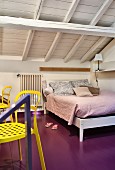 Purple-painted floor in attic bedroom