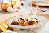 Iced chocolate cinnamon stars with oranges and coconut for Christmas