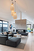 Fireplace in a partition wall in the living room with a gable roof