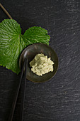 Grated wasabi with a wasabi leaf