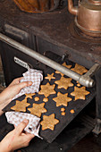 Gluten-free star-shaped nut biscuits on a baking tray