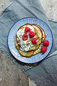 Gluten-free banana pancakes with raspberries and chia seeds