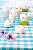 White Easter eggs decorated with black letting