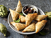 Filo pastry bites with olives, feta and artichoke (Greece)