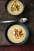 Chestnut soup with fried apple and walnuts