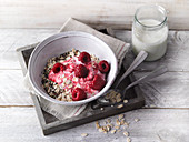Oat muesli with raspberry yoghurt and chia seeds