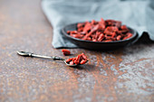 Dried goji berries in a bowl and on a spoon
