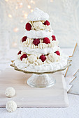 A pavlova with coconut pralines and raspberries for Christmas