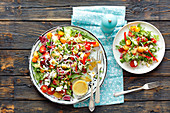 A colourful salad with feta and mustard dressing