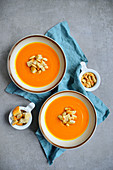 Pumpkin soup served with croutons and almonds