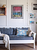 Wooden bench covered with a DIY chalk picture on a white wooden wall