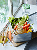 Fresh vegetable sticks with peanut hummus to take away