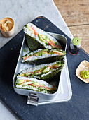 Sushi sandwiches with salmon and avocado
