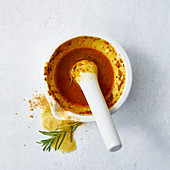 A spicy ginger marinade in a mortar