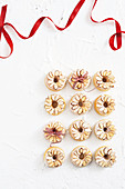 Christmas doughnuts with icing and almonds