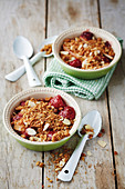 Pear and strawberry crumble topped with biscuit crumbs