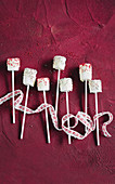 Marshmallow cake pops with white chocolate glaze and sprinkles