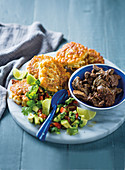 Corn fritters with fried chicken livers and avocado salsa