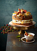 Pumpkin seed and orange cake with glazed apples, figs and cream cheese frosting