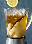 Ingredients for pear, lychee and vanilla iced tea in a blender