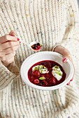 Berry soup with buttermilk dumplings and mint
