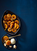 Poached clementines with vanilla ice cream