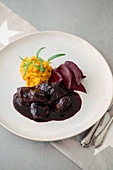Pork cheeks with pumpkin purée and beetroot