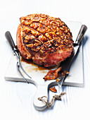 Roast ham on a chopping board