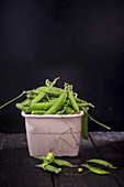 Green Pea Pods on a dark background