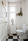 Simple toilet with chequered floor