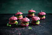 Vegan sliders made from beetroot rolls and bean burgers
